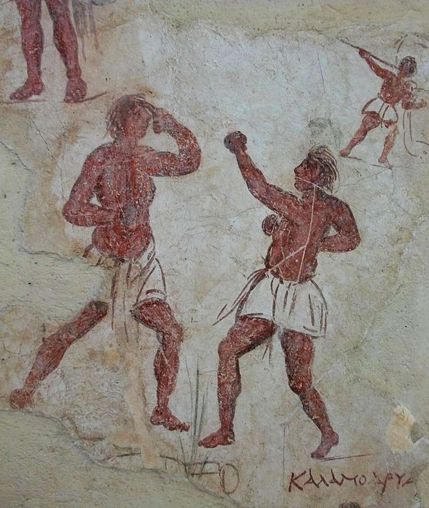 homens desenhados em parede de museu arqueológico, uma atração para quem busca o que fazer em mykonos